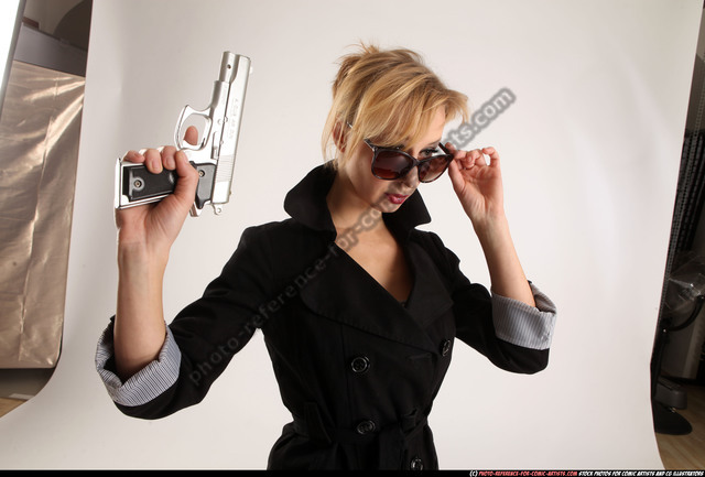 Woman Adult Athletic White Fighting with gun Standing poses Coat