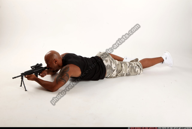 Man Adult Athletic Black Fighting with submachine gun Laying poses Army