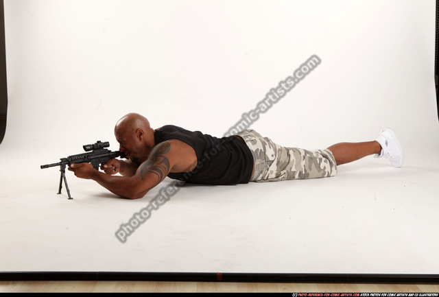 Man Adult Athletic Black Fighting with submachine gun Laying poses Army
