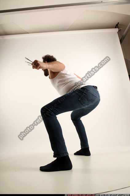 Man Adult Average White Fist fight Kneeling poses Casual