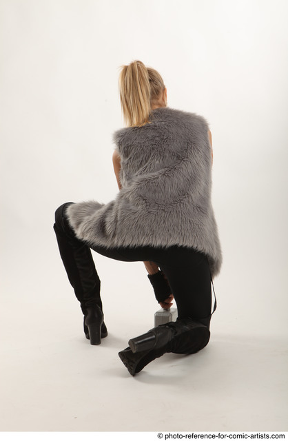Woman Adult Average White Fighting with hammer Kneeling poses Coat