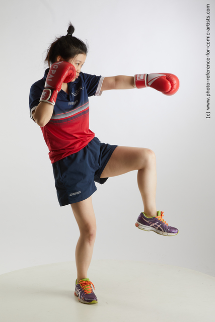 Woman Young Average Fist fight Standing poses Sportswear Asian