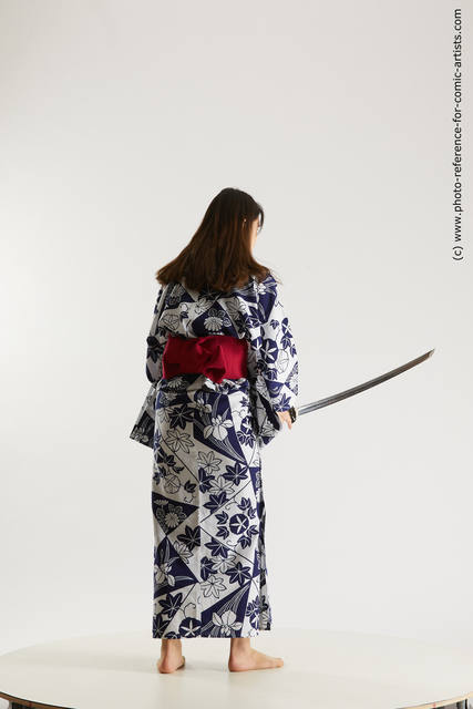 Woman Young Athletic Fighting with sword Asian Costumes