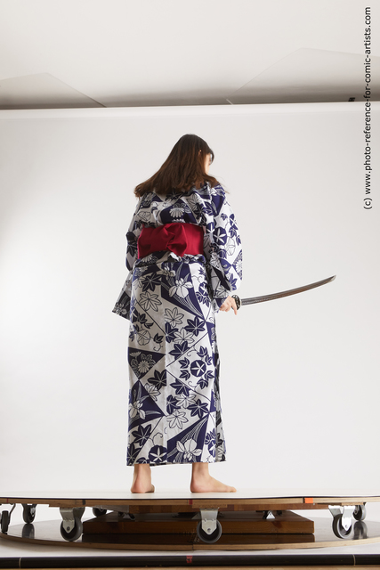 Woman Young Athletic Fighting with sword Asian Costumes