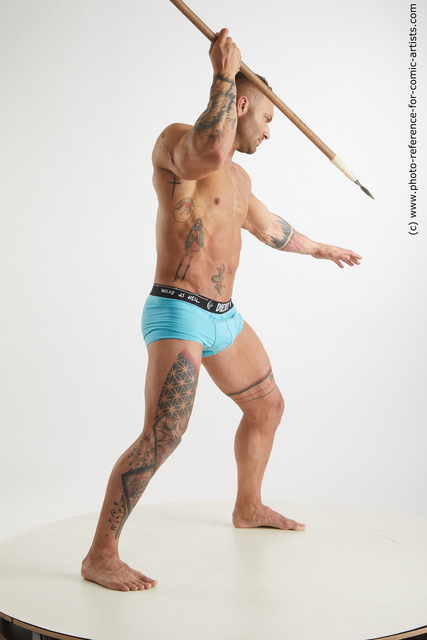 Man Adult Muscular Fighting with spear Standing poses Underwear