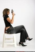 woman-sitting-revolver-pose1