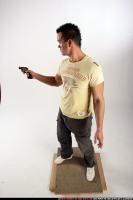 johnny-standing-revolver-pose
