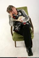 oldwoman-sitting-reading-sad