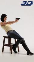 3d-stereoscopic-natalie-sitting-leaning-back-shooting-pistol